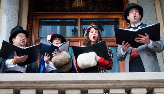 Quartet of Carolers in Dickensian dress