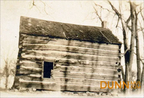 Sepia toned image of small cabin, civil-war era